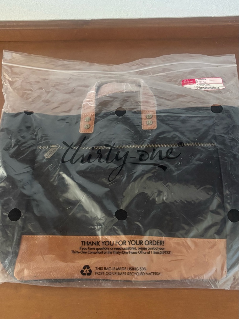 Brand new Thirty-One Black Step up Tote with Tan Trim